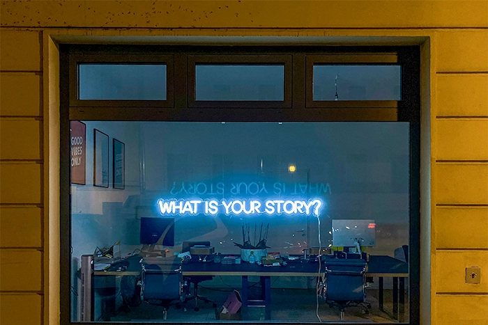 Image of desk lamp shining on paper with coming soon text